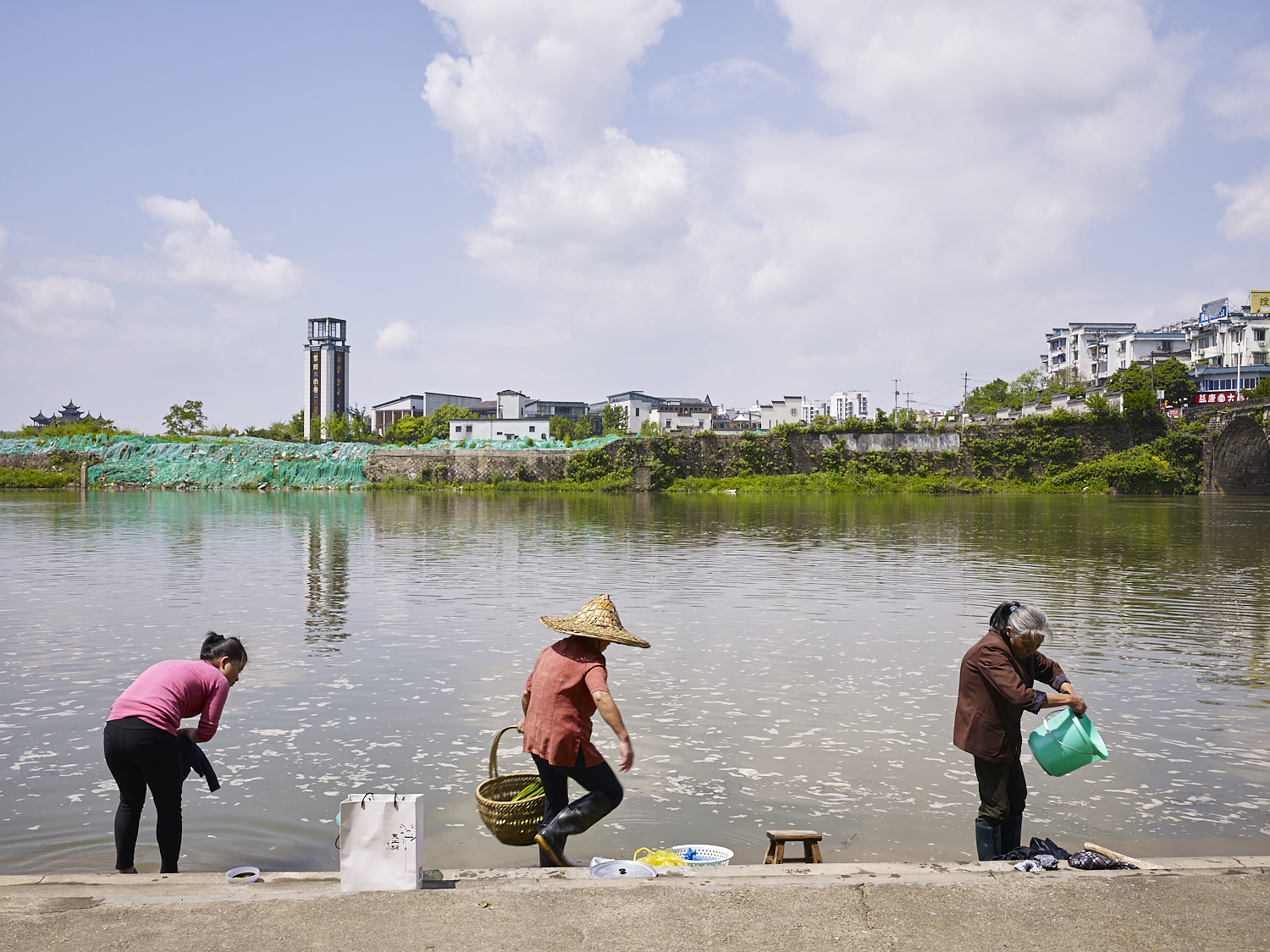 Washing clothes and vegetables, Xin'an River, Huangshan, China, 2017